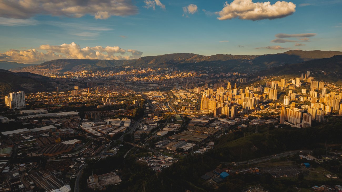 Aerial view of Medellín in the valley at golden hour