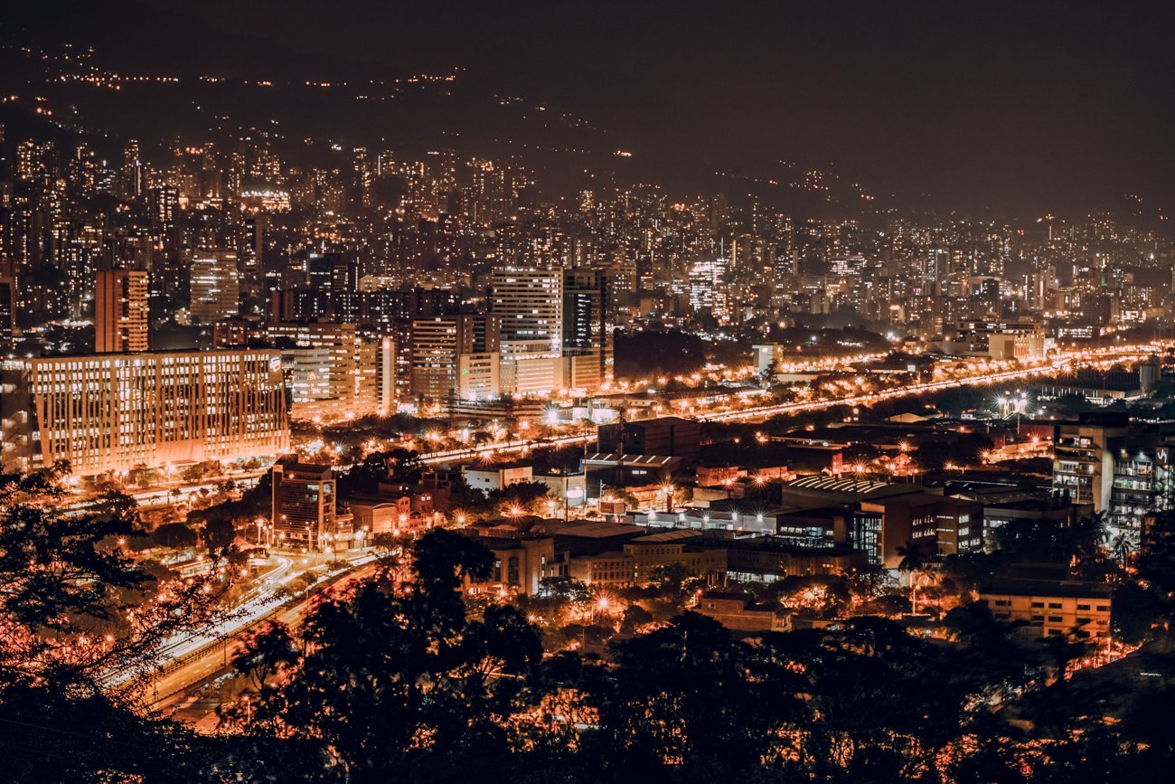 Medellín skyline glowing at night